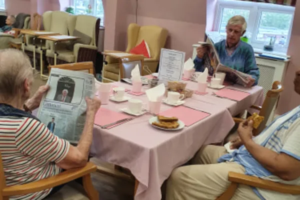 Residents enjoying fresh lunch in the social dining room