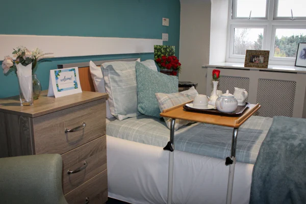 Warm morning wake-up with tea in a resident's bedroom