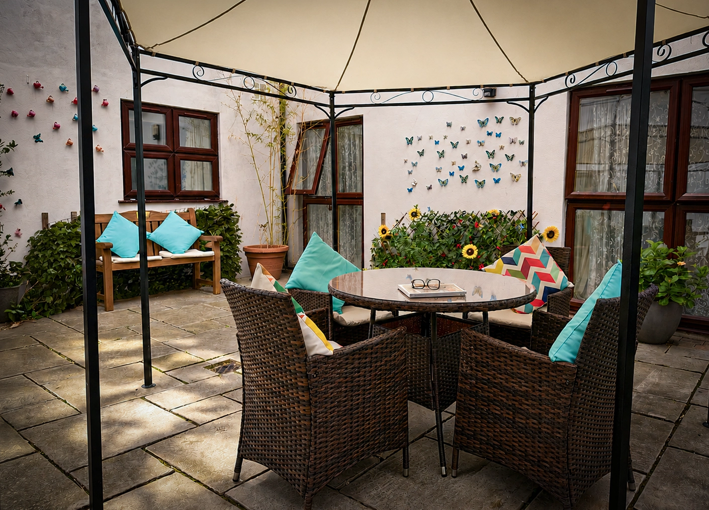A peaceful garden seating area under a wooden arbor
